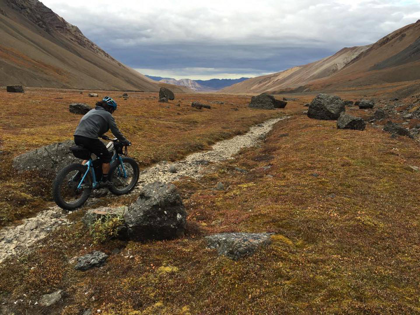 Clinton Hodges III rides through the Alaska Range