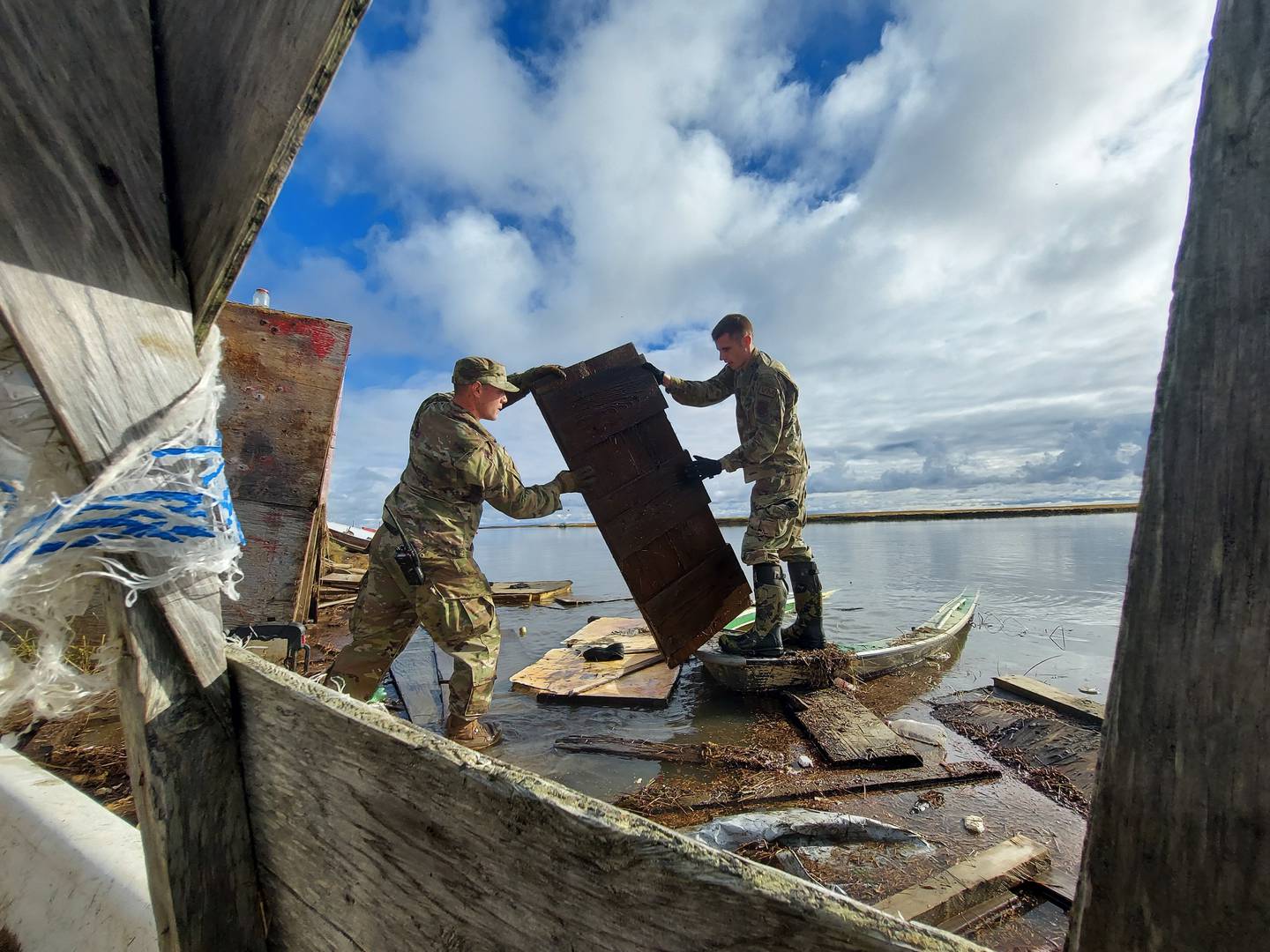 Service members in Joint Task Force - Bethel assist the community of Chevak, Alaska in storm recovery efforts for Operation Merbok Response