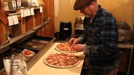 This Unalakleet restaurant is delivering hot pizza and warm messages to exhausted Iditarod mushers
