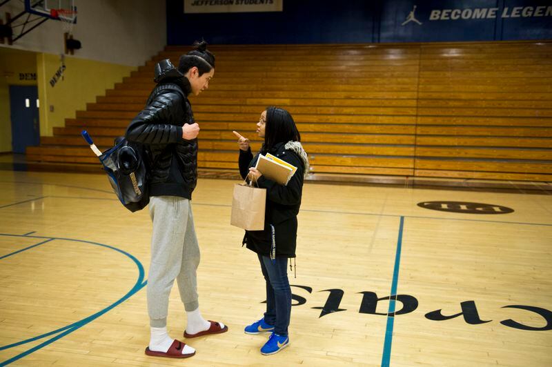 Sara Lawrence, right, tells Kamaka Hepa to stay out of trouble before he leaves the gym at Jefferson High School. “He’s one of my good students,” said Lawrence, of Self-Enhancement Inc., which works in the school to provide support services for students. (Marc Lester / ADN)