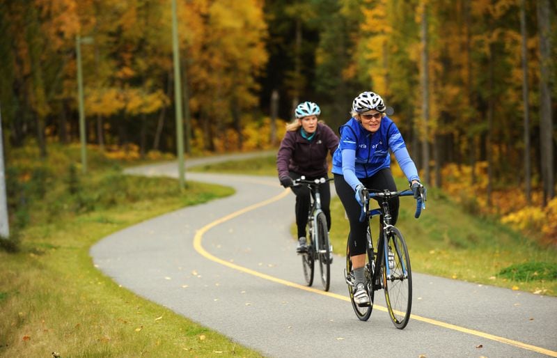 Sheryl Mohwinkel-Fleming and her mother Diane Mohwinkel ride the bike trails in Kincaid Park on Sept. 21, 2011. (Bob Hallinen / ADN)