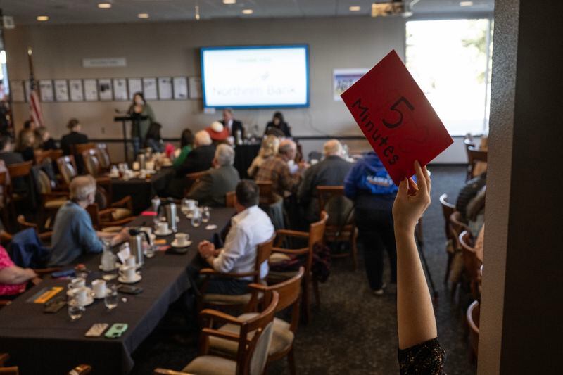 Danicia Shiryayev, Anchorage Chamber of Commerce board vice chair, holds up a time-limit warning. (Marc Lester / ADN)