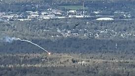 Video shows F-16 fighter jet dropping flares above Anchorage Hillside during Biden visit