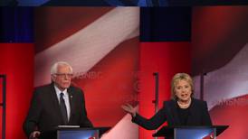 In sharp clash, Clinton, Sanders swap barbs and views