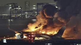 Passenger jet and coast guard plane catch fire after collision at Tokyo airport, killing 5