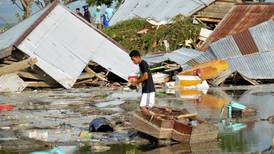 Hundreds confirmed dead as Indonesia tsunami and earthquake devastate coast
