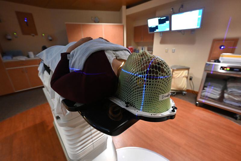 An aquaplast mask is used to stabilize Elishaba Doerksen during radiotherapy at Providence Cancer Center. (Bill Roth / ADN)