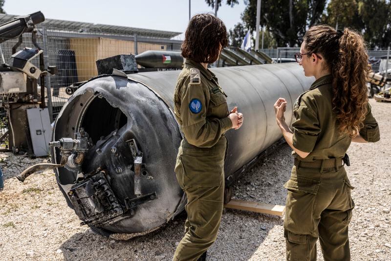 Israeli soldiers near one of the Iranian ballistic missiles that Israel intercepted last weekend. (Heidi Levine for The Washington Post)