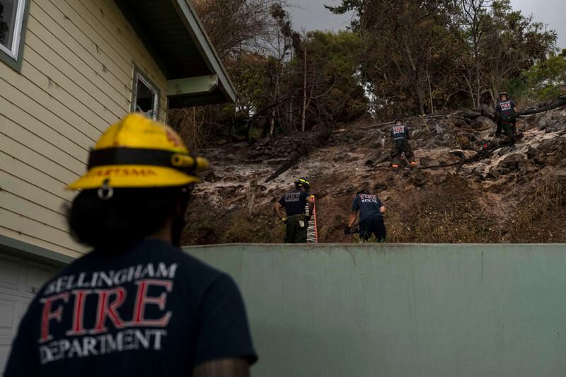 Firefighters clear debris in Kula, Hawaii, Tuesday, Aug. 15, 2023, following wildfires that devastated parts of the Hawaiian island of Maui. (AP Photo/Jae C. Hong, File)