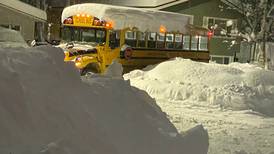 Students returning to school in Anchorage faced with stuck buses and snow berm-covered sidewalks 