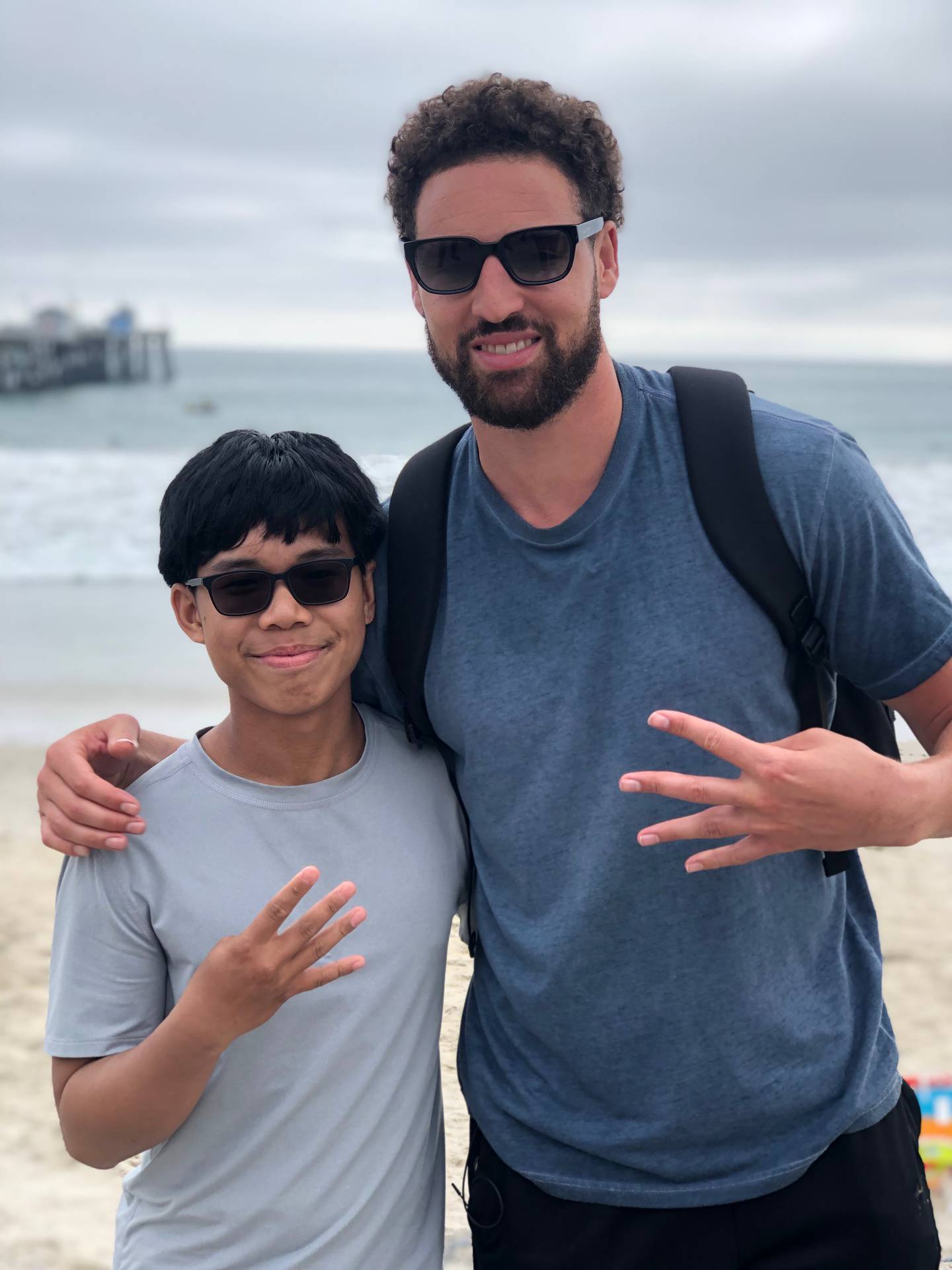 Golden State Warriors all-star Klay Thompson poses for a photo with Joseph Tagaban