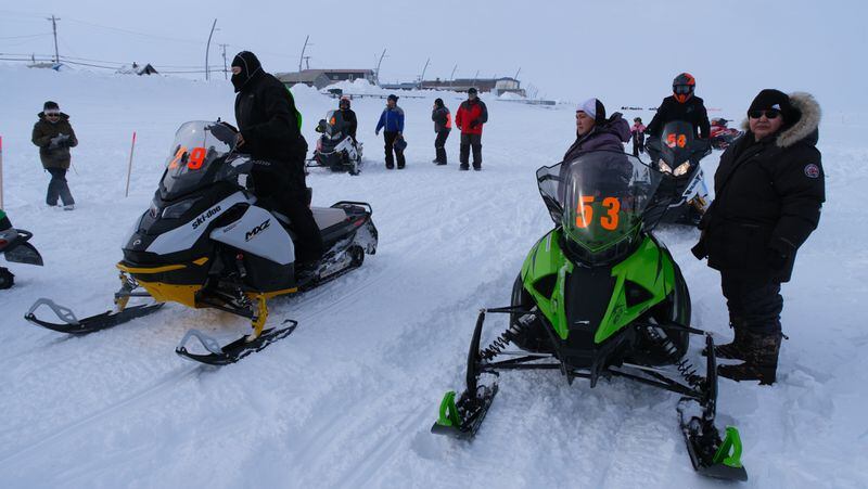 Jennifer Smith, #29, and Amelia Williams, #53, prepare to take off to race in Gunner 120 snowmachine race on April 13, 2024. Photo by Jim Evak.
