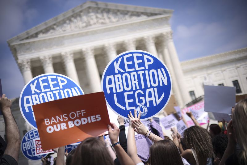 AQbortion activists demonstrate in front of the Supreme Court Building on Tuesday, May 3, 2022, in Washington, D.C. (Win McNamee/Getty Images/TNS)